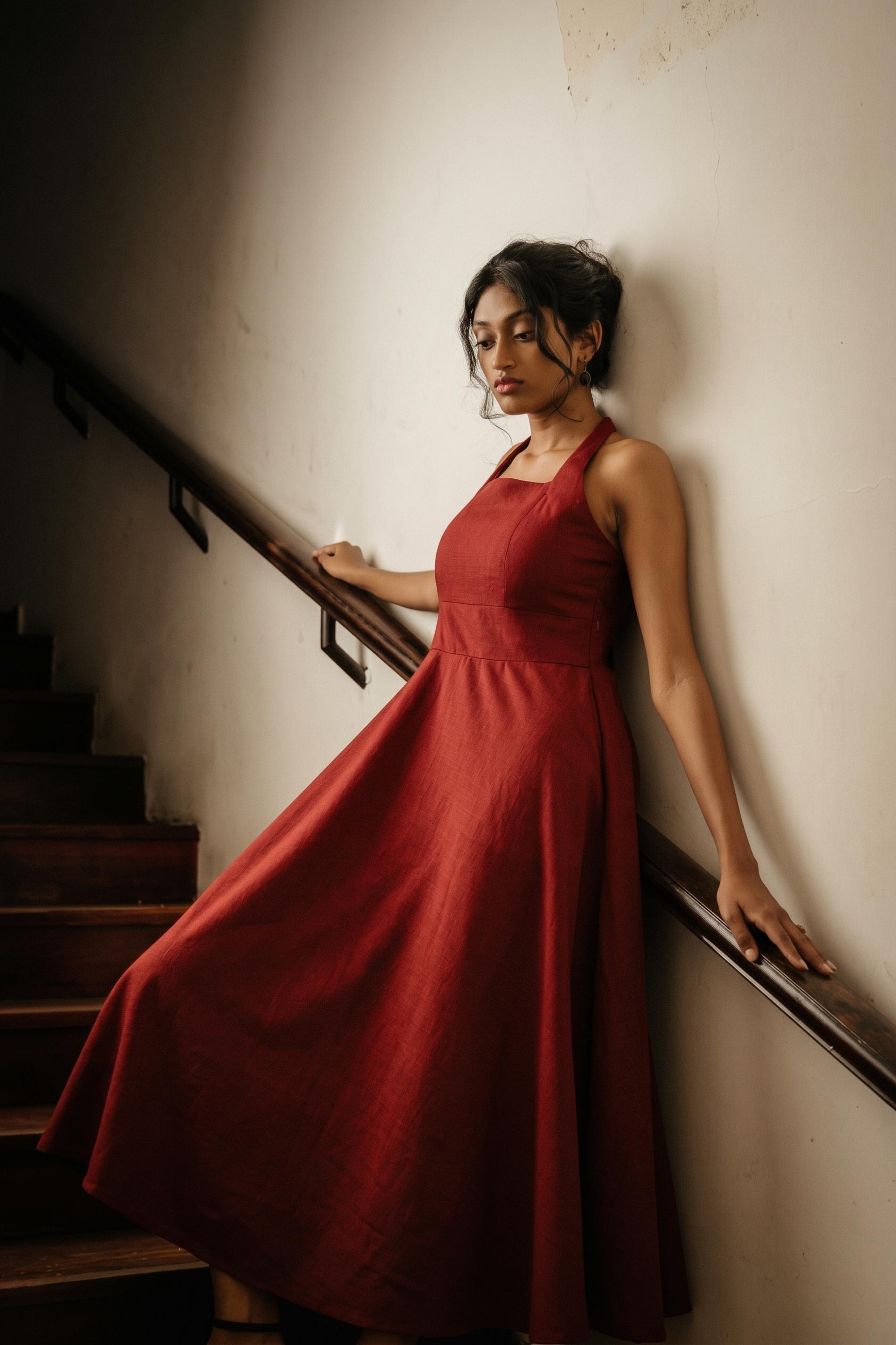 Crimson linen gown on the teak staircase